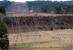 Power lines cut through a valley, leading away from Bonneville Power Administration’s Earl D. Ostrander Substation near Eagle Creek, Jan. 5, 2023.