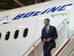 Then-President Barack Obama walks down the stairs of a Boeing 787 Dreamliner at the company's production facility in Everett, Wash., in 2012.