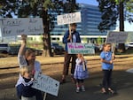 Neighbors of Daimler Trucks North America, a truck maker in Portland's Swan Island industrial district, protest the plant's emissions at a recent unveiling of new headquarters.