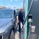 Granholm approaches a charging station to charge the Cadillac Lyriq she was riding during a four-day road trip through the southeast early this summer. The electric vehicle had charging problems due to an "isolated hardware issue," Cadillac says. But Granholm's team encountered plenty of not-so-isolated problems too.