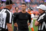 Carolina Panthers head coach Dave Canales talks to referees before an NFL football game against the Denver Broncos Sunday, Oct. 27, 2024, in Denver. (AP Photo/Jack Dempsey)