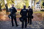 Portland police Lt. Jeff Niiya, right, with the police bureau's rapid response team at a protest in downtown Portland, Ore., Saturday, Nov. 17, 2018.