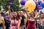 Portland Pride Parade-goers wave to the crowd Sunday, June 18, 2017. 