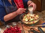 “Art of the Pie” author Kate McDermott preps the filling for two pies — apple-pear and cranberry — prior to a pie-baking workshop at Bob's Red Mill in Milwaukie, Oregon.