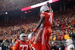 Ohio State receiver Jeremiah Smith, top, celebrates after his touchdown against Tennessee in the second half of the first round of the College Football Playoff, Saturday, Dec. 21, 2024, in Columbus, Ohio.