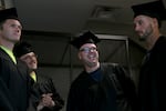 (Left to right) Tyler Boyce, Daniel Hopkins, Brian Rafferty and Garret Bergquist wait for their graduation ceremony to start at the Deer Ridge Correctional Institution in Madras, Ore., on June 9, 2026. Central Oregon Community College provides education opportunities to incarcerated people serving time at Deer Ridge.