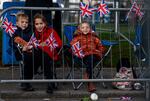 Children gather along the streets as they wait to view the cortege carrying the coffin of the late Queen Elizabeth II in Ballater, United Kingdom.