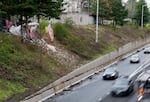 FILE: A homeless encampment perched along southbound I-5 in Portland in January 2022.