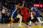 Portland Trail Blazers guard Jrue Holiday (5) moves the ball while defended by Golden State Warriors guard De'Anthony Melton (8) during the first half of an NBA basketball game, Tuesday, Jan. 13, 2026, in San Francisco.