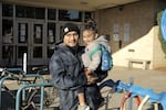 Marcos Dominguez and his three-year-old Santiago get ready to start preschool again at Lent Elementary in Southeast Portland on Monday.