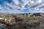Damage from a late-night tornado is seen in Sullivan, Ind., Saturday. Multiple deaths were reported in the area following the storm.