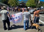 Across the street from Rogue River City Hall, men yell cuss words and names at Black Lives Matter protesters on Saturday.