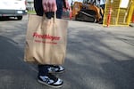 Instacart shopper Carl Momberger delivers groceries in Portland, Ore. on March 5, 2020. As the new coronavirus spread in the Northwest, he hoped customers would let him leave the bags at their door. 