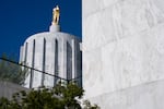 The Oregon Pioneer statue sits atop the Oregon State Capitol in Salem, Ore., on Sept. 8, 2026.