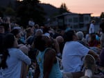 Crowds gather to see migrating Vaux's swifts roosting in the chimney at Chapman Elementary in Portland, Oregon.