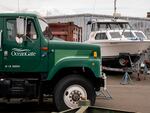 The OceanGate logo is seen on a vehicle stored near the company's offices on Wednesday in Everett, Wash. The company owns the submersible that has been missing since Sunday.