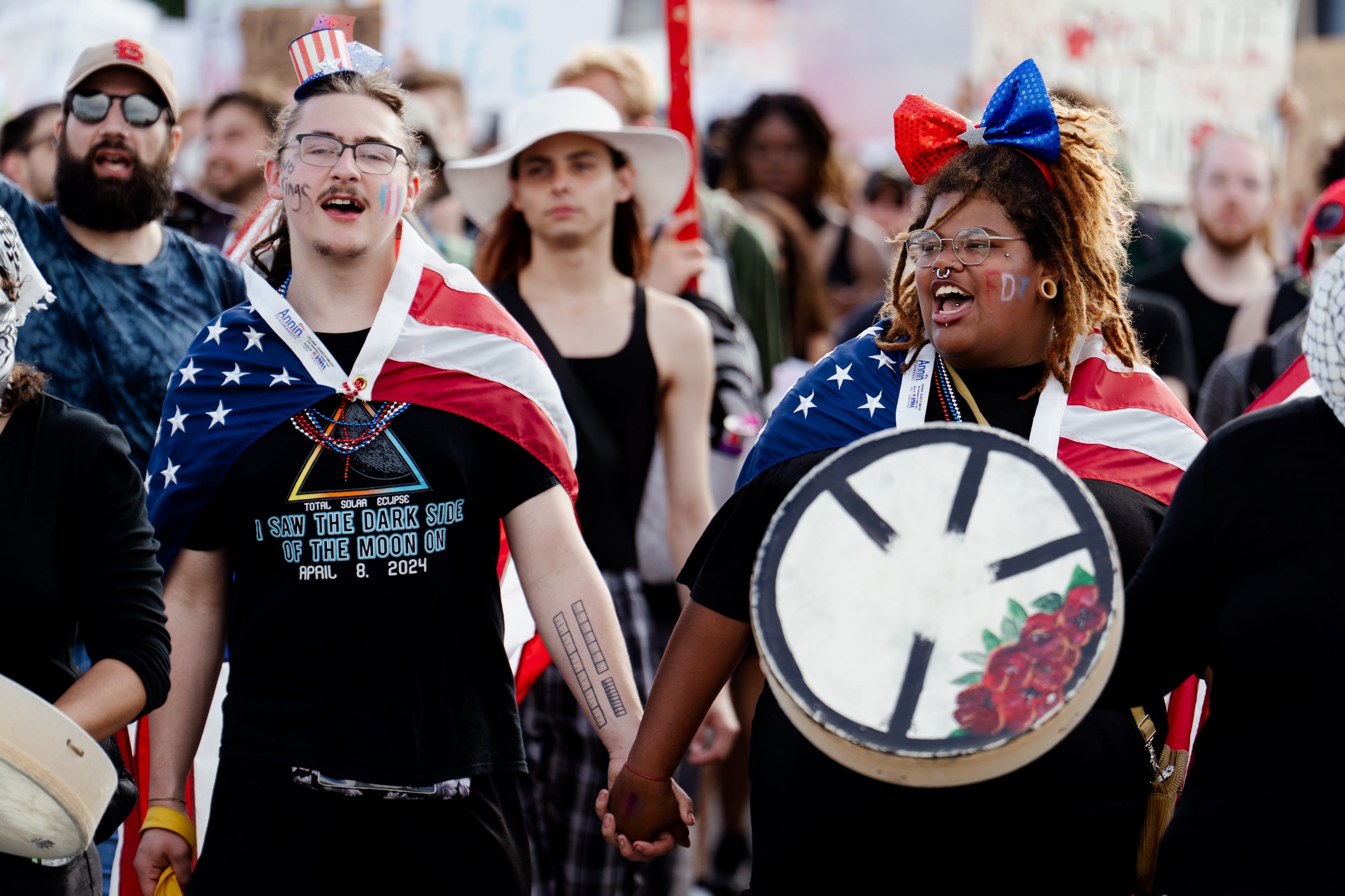 St. Louis: James Slinkard, 21, holds hands with Taylor Cunningham, 22, both of Cape Girardeau, Mo., while protesting.