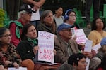 Local residents and land conservation groups holding signs in opposition of expanding Hillsboro's urban growth boundary outside the Hillsboro Civic Center on Oct. 10, 2024.