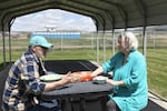 Ric Seaberg and Marie Deatherage eat lunch at a park in Jordan Valley.