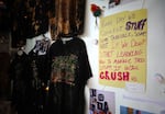 A quote from Becky Lange was pinned on the wall at Ground Score Association in Portland's Old Town on June 4, 2026. The event featured shirts, a tiny fabric dumpster fire on a keychain, and other crafts Lange made before she was fatally assaulted in May.