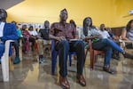 Bissau, Guinea-Bissau (September 23, 2024) - Antonio Queba Banjai, a direct descendant of the last Emperor of Kansala and President of Guinea-Lanta!, an NGO that collaborated with the archeological dig in Kansala, listens to the presentation of the findings at Guinea-Bissau's National Institute of Study and Research, INEP.
