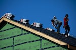 Contractors work on the roof of a house under construction in Louisville, Ky., on July 1. "America's fallen 3.8 million homes short of meeting housing needs," says Mike Kingsella, the CEO of research group Up for Growth, which on Thursday released a study about the problem of housing shortages. "And that's both rental housing and ownership."