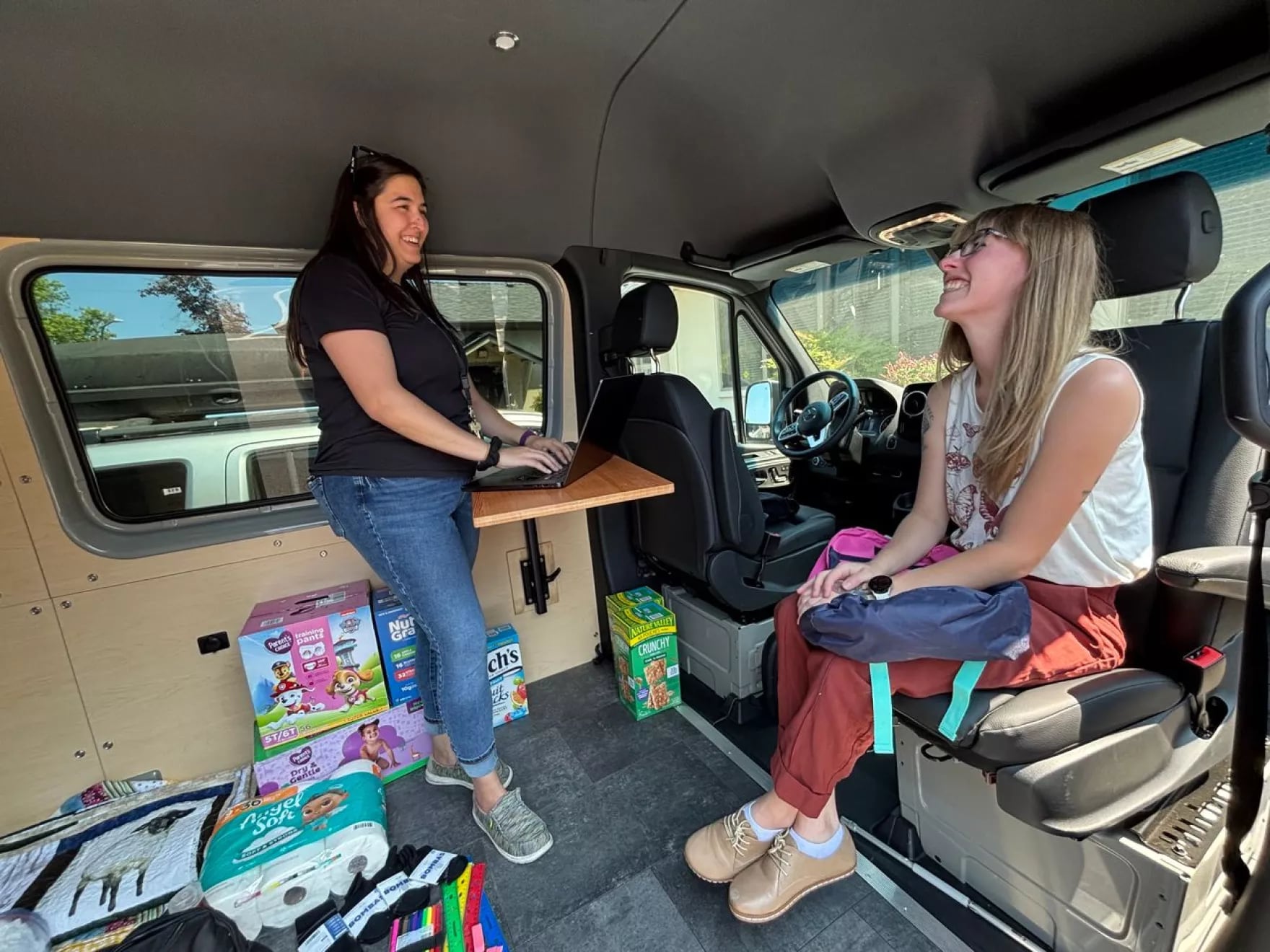 Maslow Project employees demonstrate how case management appointments might work in their new mobile van.