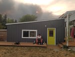 Jefferson Public Radio reporter April Ehrlich reports from a friend's backyard in Medford, Ore., after evacuating her home due to a nearby wildfire on Tuesday, Sept. 8, 2020. Ehrlich had to evacuate further after this photo was taken.