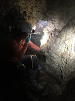 Sarah Wolfe, a member of the cave exploration team, helps collect sediments from one of the caves in Hells Canyon.
