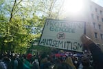 Hundreds of people attend a pro-Palestinian protest on Portland State University's campus on April 29, 2024. A protester is holding a placard that reads "Protesting genocide doesn't equate to antisemitism."