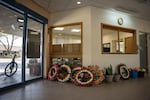 Funeral wreaths lines up against a wall in the administrative office of Kiibbutz Beeri, Israel on September 23. A few hours later a reburial ceremony took place for a mother and son that had been killed on October 7th and buried outside the Kibbutz as it was not safe to gather there in the beginning of the war.