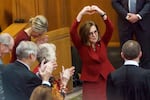 Former Gov. Kate Brown gestures to the crowd after being acknowledged by Gov. Tina Kotek during Kotek’s inauguration at the Oregon Capitol in Salem, Ore., Jan. 9, 2023.