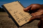 Anthony Bland holds a notebook he's used to calculate diesel fuel price increases, which have spiked due to the closure of the Strait of Hormuz.