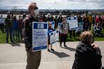 Supporters of PeaceHealth Southwest Medical Center nurses hold signs  during a rally at Vancouver's waterfront on April 10, 2021.