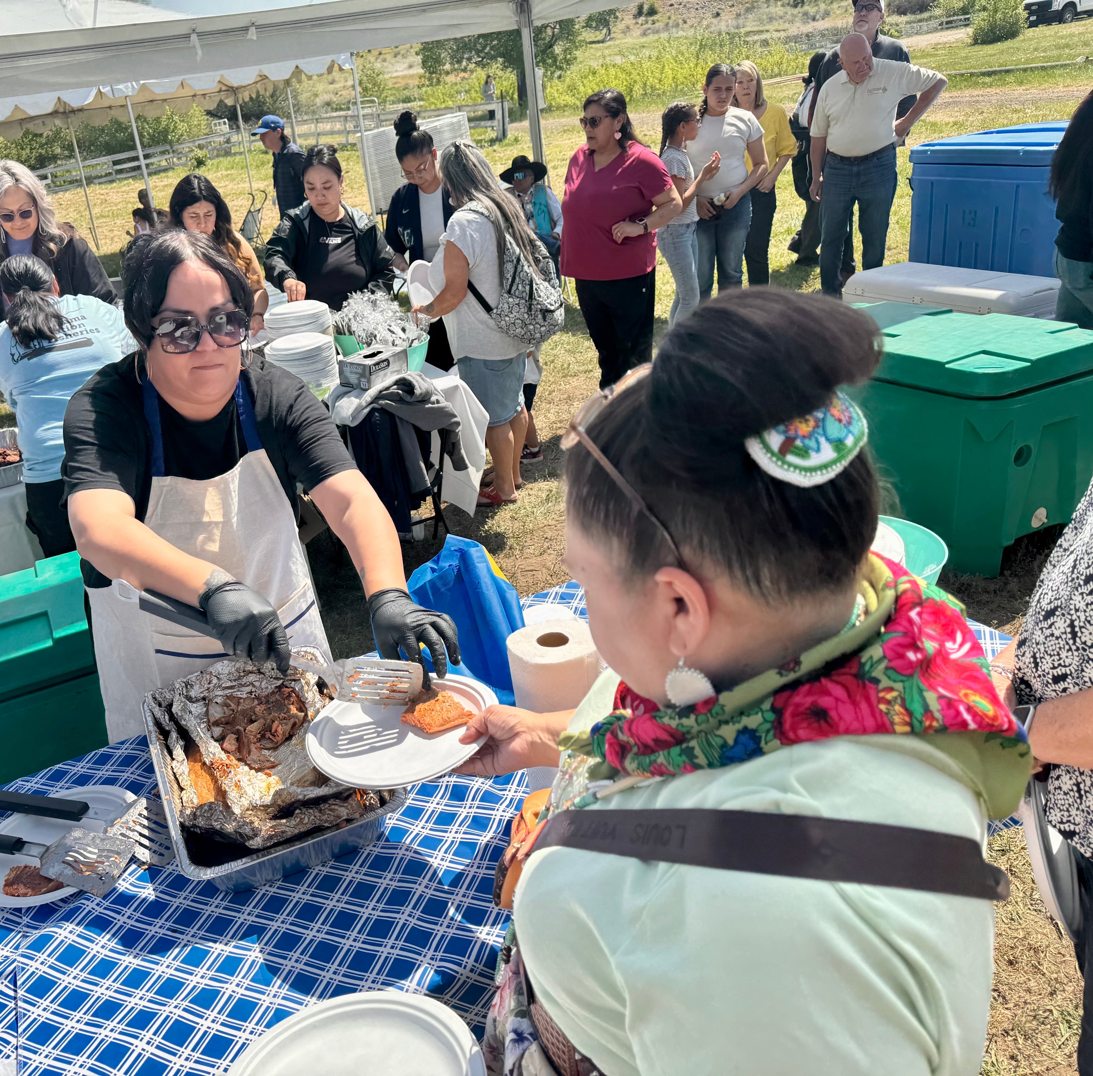 The Yakama Nation served up salmon and other foods for people to celebrate the Springwood Ranch acquisition.
