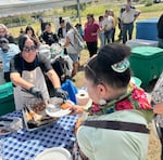 The Yakama Nation served up salmon and other foods for people to celebrate the Springwood Ranch acquisition.