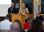 FILE - Margaret Calvert of Portland Public Schools speaks to an audience at Ida B. Wells High School in Portland, Ore., during a meeting to discuss how to “rightsize” the district's schools, on April 22, 2026. PPS plans to close up to 20 schools by the 2027-2028 school year.