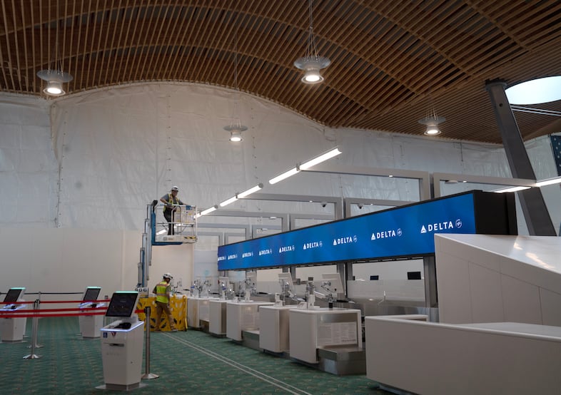 Construction continues in the ticketing area at the Portland International Airport, Aug. 2, 2024. After the opening of the new terminal on Aug. 14, 2024, the white construction walls will remain in place as renovation begins in the old ticketing area. 