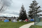 Homeless Grants Pass residents are required to move from one park to another every 72 hours under threat of citations or jail time. Neighbors say public parks have become unusable.