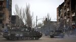 Russian military vehicles move in an area controlled by Russian-backed separatist forces in Mariupol, Ukraine on Saturday.