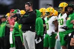 Oregon head coach Dan Lanning watches from the sideline during the second half of an NCAA college football game against Washington, Saturday, Nov. 29, 2025, in Seattle.