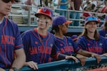 From left to right: Coach Matt Williams, second baseman Amanda Gianelloni, catcher Samantha Gutierrez, and left fielder Skylar Kaplan of the San Francisco Firebells in the dugout at Robin Roberts Stadium prior to their first game in the Women's Pro Baseball League. Springfield, IL, August 2, 2026.