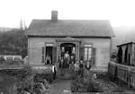 In this undated image, residents stand outside of the Jackson County, Ore., poor farm.