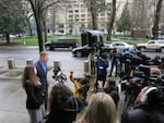 Ammon Bundy's attorney, Mike Arnold, speaks in Portland. Bundy said, according to his attorney "we have spent endless hours for weeks meeting with residents in Harney County."