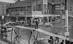 This image from 1894 shows a man using a raised bridge at Portland’s Third Street.