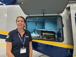 NEST scientist Jaqueline Brandon displays radiation detection equipment inside one of NEST's helicopters. "hen I found out as a scientist I get to fly in a helicopter and do real national security missions, I was like sign me up right away.