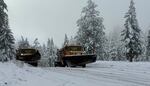 In this undated provided photo, Oregon Department of Transportation vehicles clear snow from roads. Parts of the Oregon Cascades could see multiple inches of snow over the next couple of days.