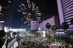 Revelers celebrate the New Year at the Selamat Datang Monument at the Hotel Indonesia roundabout in Jakarta, Indonesia.