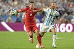 Switzerland's midfielder Remo Freuler (L) and Argentina midfielder Alexis Mac Allister fight for the ball during the World Cup quarterfinal in Kansas City on Saturday.