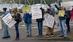 FILE - Supporters for city workers in Portland hold a rally at the Bureau of Transportation’s Stanton Yard in North Portland, Jan. 18, 2022. District Council of Trade Unions’ negotiations with the city have reached an impasse and DCTU is considering striking next month. 